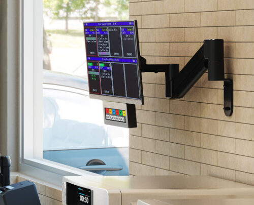 Monitor arm configured to wall-mounted kitchen display system Monitor arm configured to wall-mounted kitchen display system